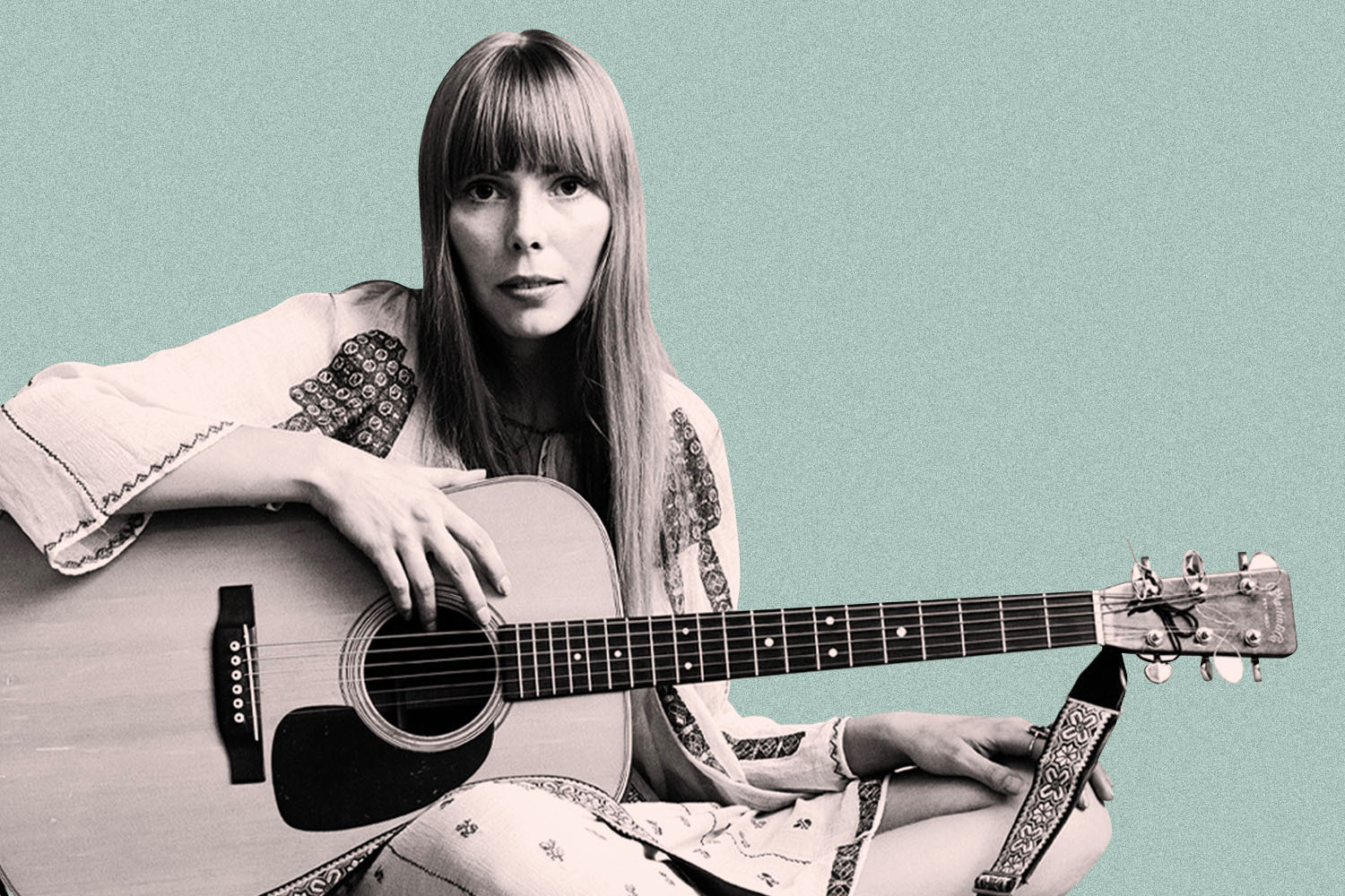 Black and white image of Joni Mitchell holding guitar, on light blue background